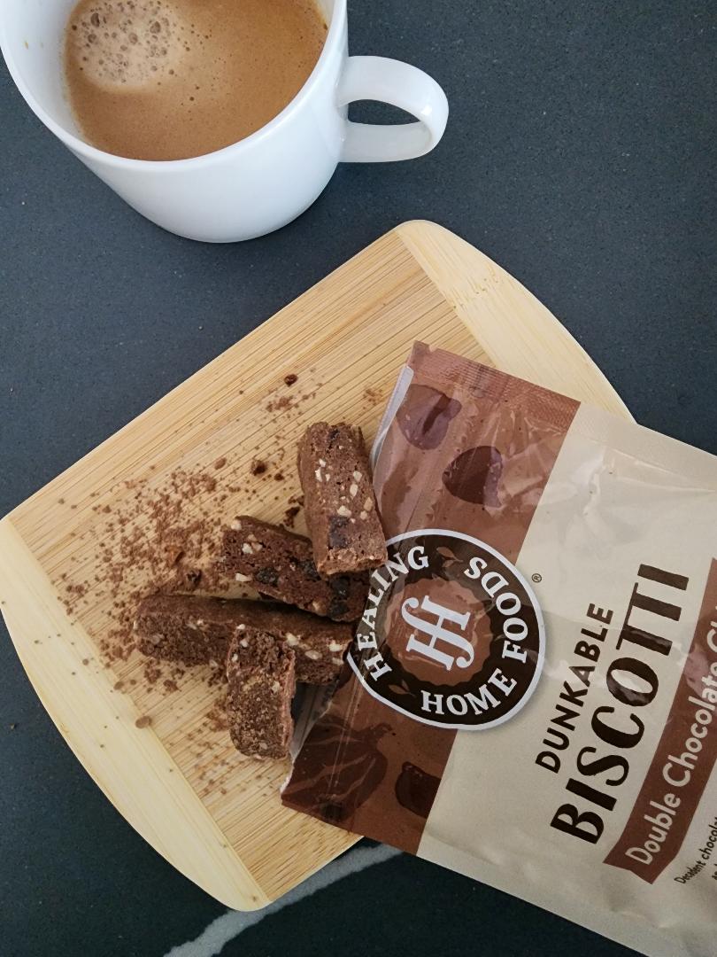 Healing Home Foods Dunkable Biscotti with a cup of coffee on a wooden board.